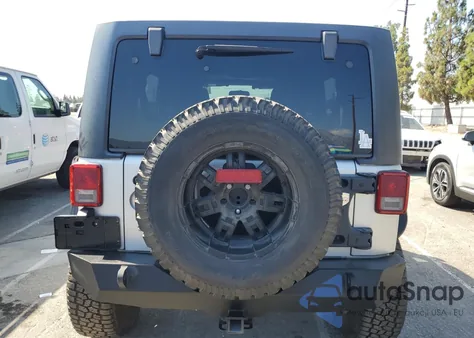 2011 Jeep Wrangler Unlimited Sahara из США, поврежденный, VIN 1J4BA5H16BL521963